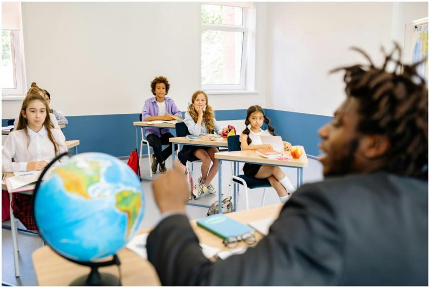 A diverse group of students and their teacher enga