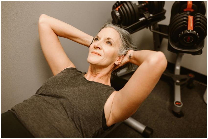 A senior woman performing exercises with dumbbells