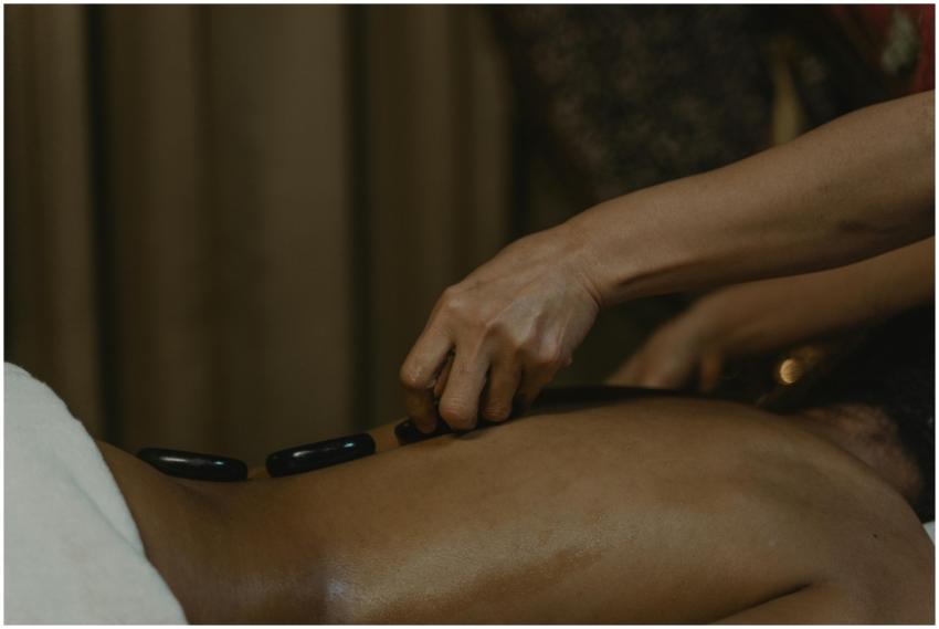 Close-up of a soothing hot stone massage session f