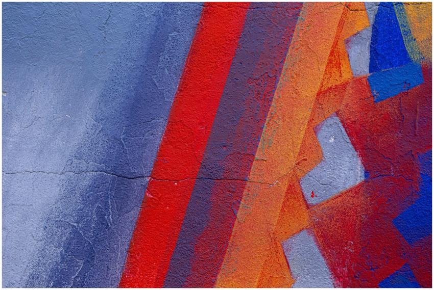 Vibrant abstract street art mural featuring bold c