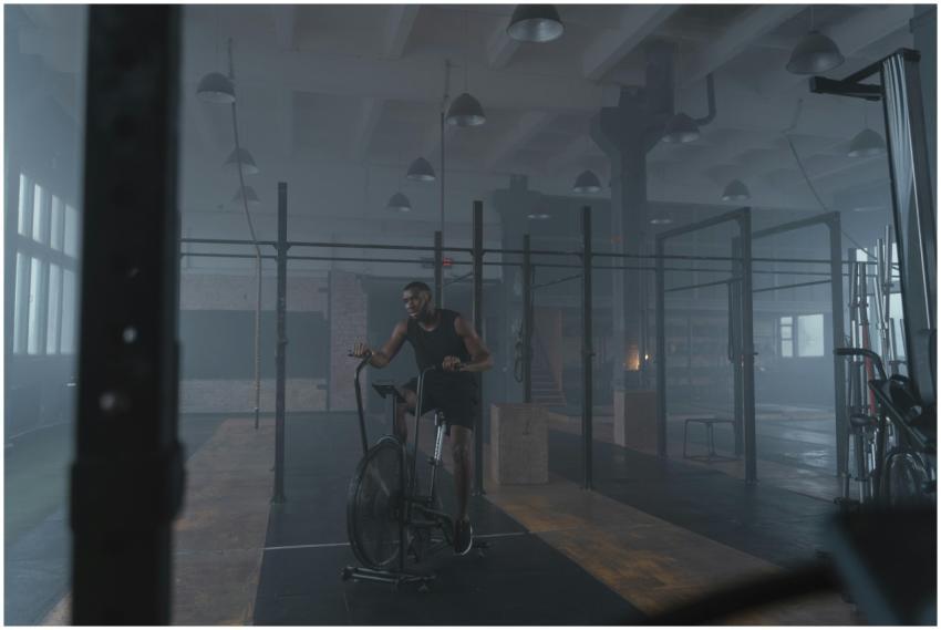 Focused athlete exercising in an industrial-style