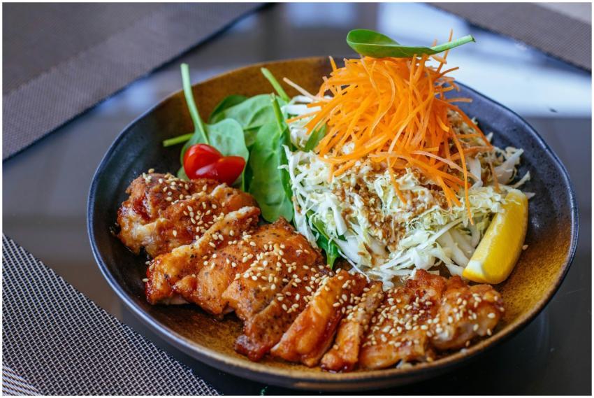 A vibrant and healthy salad bowl with grilled chic