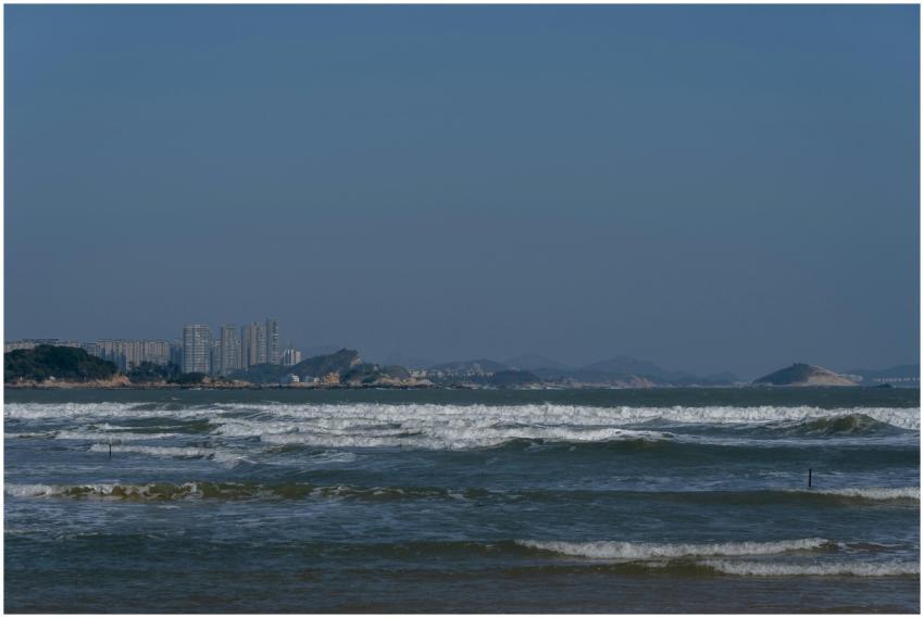 Beautiful seaside landscape with city skyline and