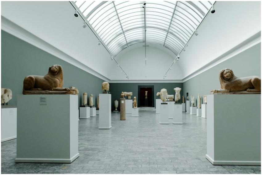 Art gallery interior with lion sculptures on displ