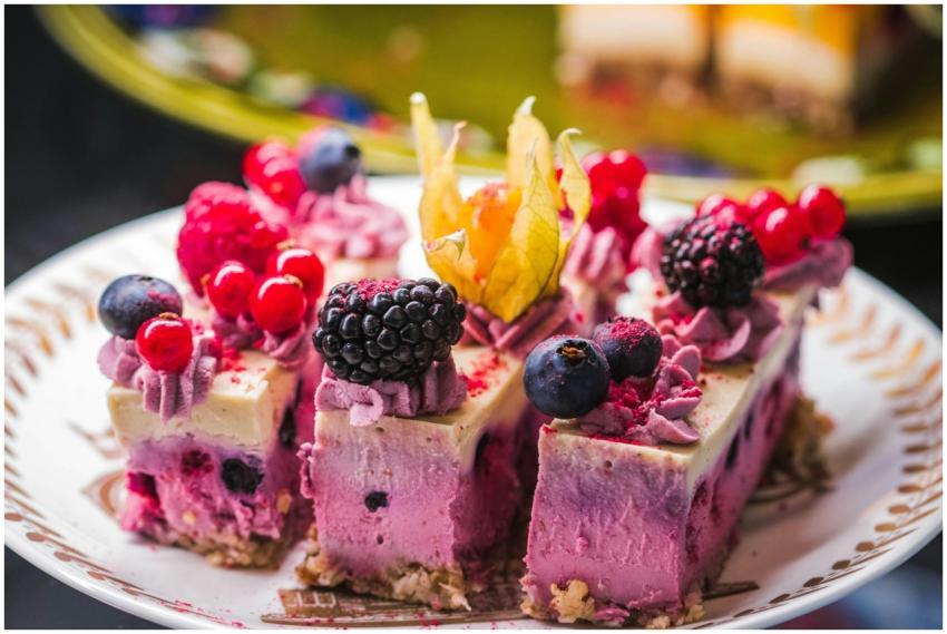 Tantalizing slices of mixed berry cheesecake toppe