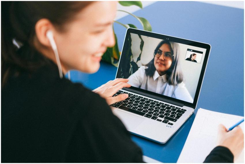 Woman having a video conference on a laptop, smili