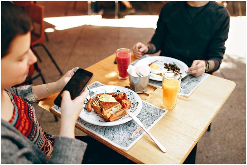 Two people enjoy brunch outdoors in Brazil, captur