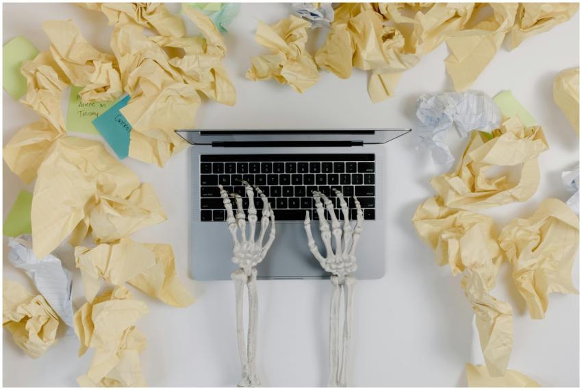 Conceptual image of work fatigue: skeleton hands t