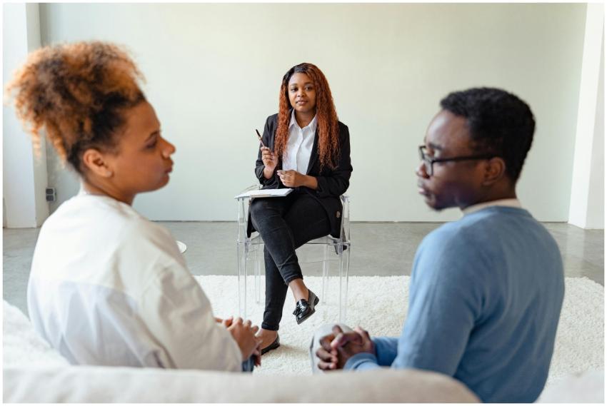 Therapist mediating a counseling session for a cou