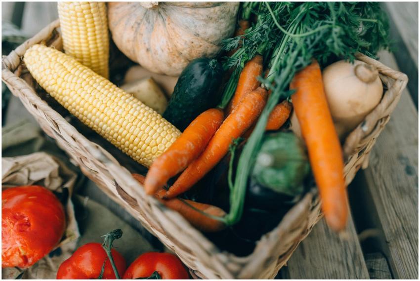 A close-up of fresh organic vegetables in a wicker