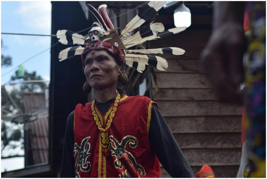A Dayak man in traditional costume during a festiv