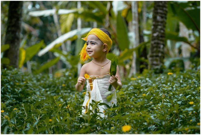 An adorable child in traditional Indian clothing e