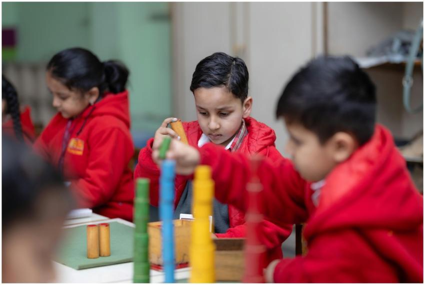 Young children focused on Montessori educational a