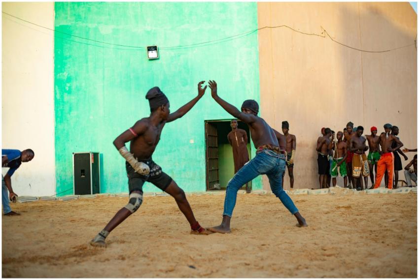 Dynamic scene of a traditional wrestling match wit