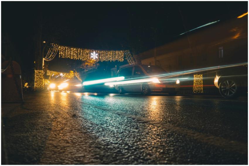 Captivating scene of cars in motion with festive l