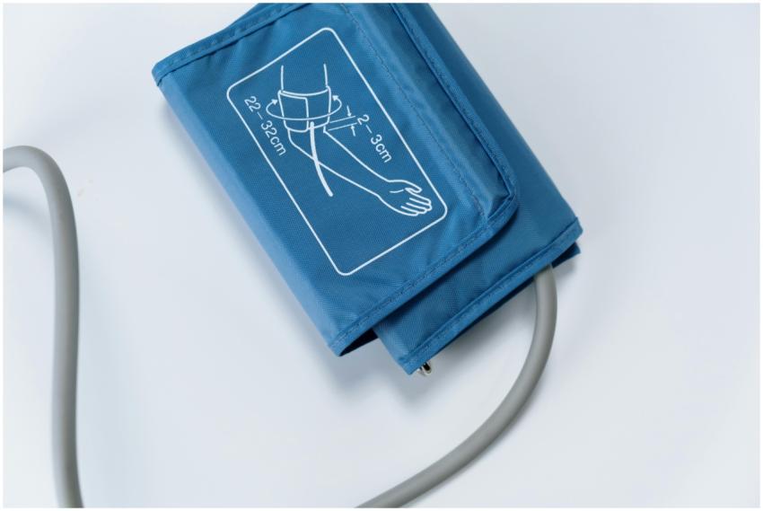 Close-up of a blue blood pressure cuff on a white