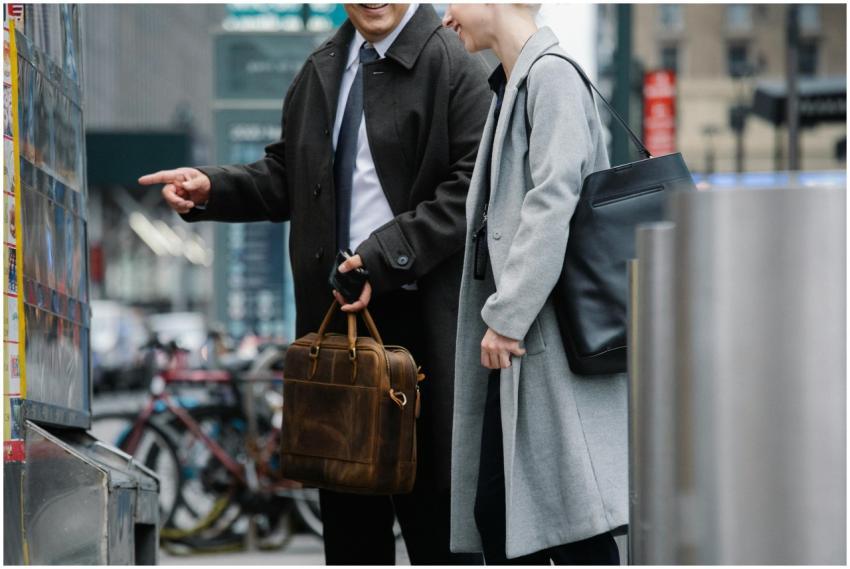 Two business professionals in formal wear ordering
