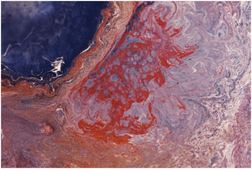 Vibrant abstract fluid art with swirling red and b