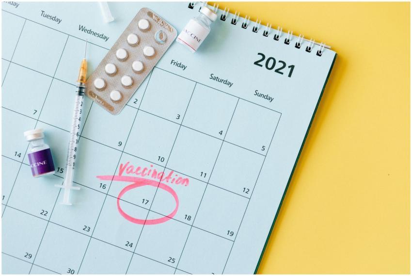 Calendar with vaccination date circled alongside v