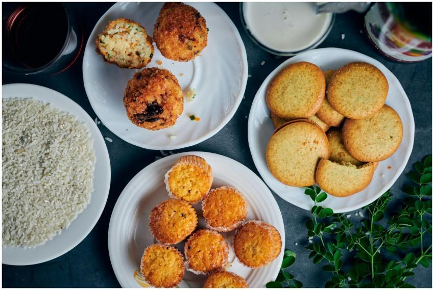 Top view of various homemade cookies and muffins a