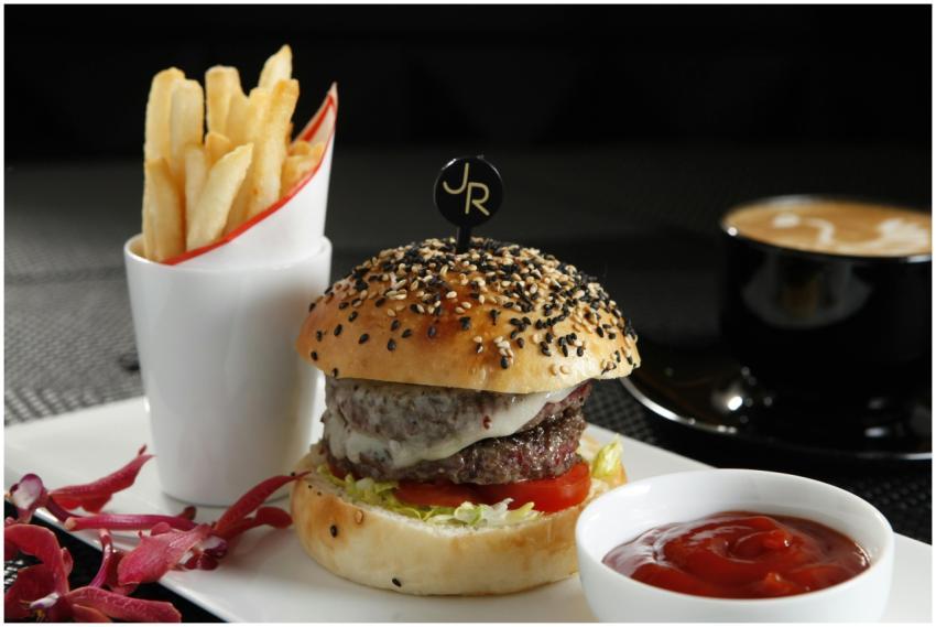 Appetizing gourmet burger with fries and coffee, p
