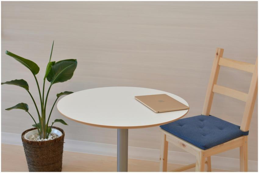 A sleek minimalist office space featuring a table