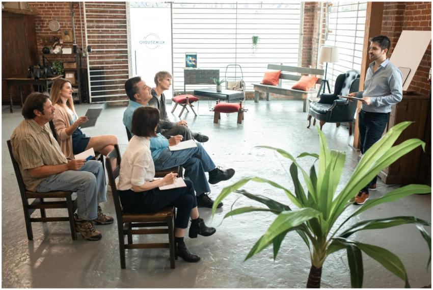 Diverse group of adults engaged in a workshop sess