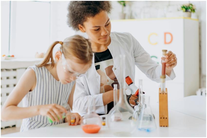 A teacher and student engage in a hands-on science