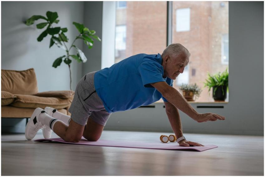 Elderly man exercising on a yoga mat at home, prom