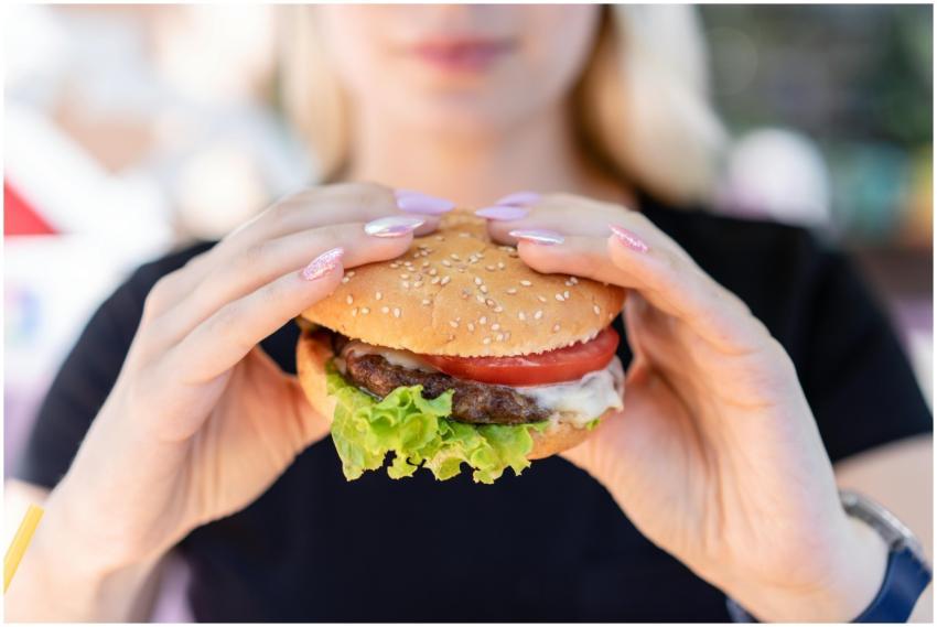 A close-up of a delicious burger with fresh ingred