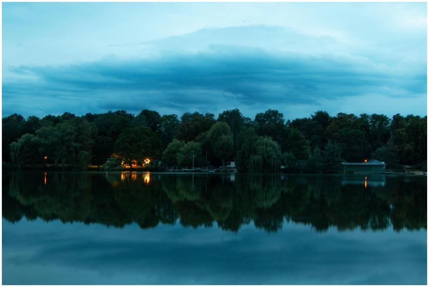 Tranquil lakeside landscape with reflections at tw