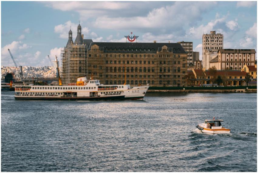 A scenic view of a ferry navigating the waters in