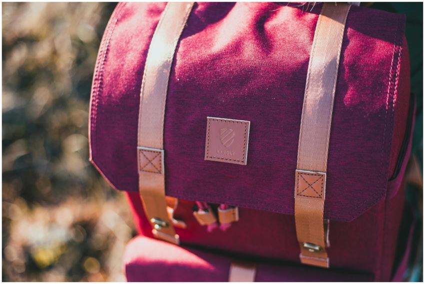 Explore the details of a stylish red backpack in a