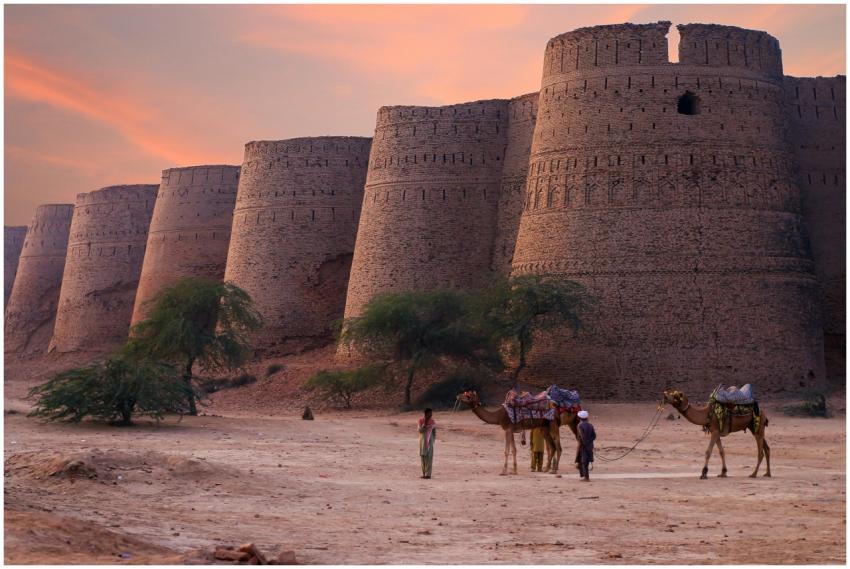 Scenic view of Derawar Fort's towers at sunset in