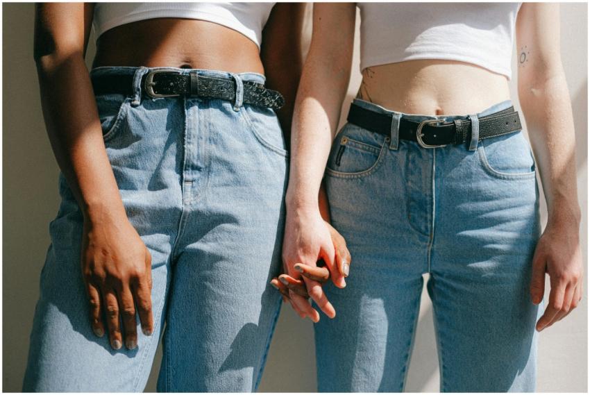 Close-up of interracial lesbian couple holding han