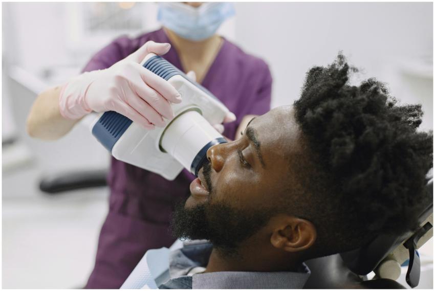 A patient receiving a dental x-ray from a dentist