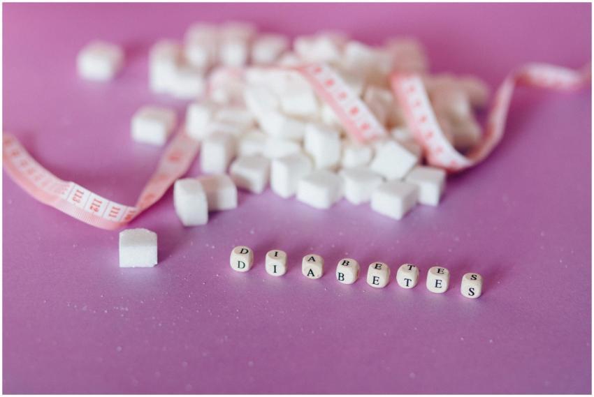Still life of sugar cubes and diabetes concept wit