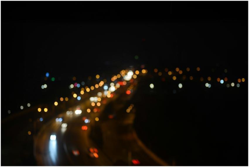 A captivating image of a highway at night with blu