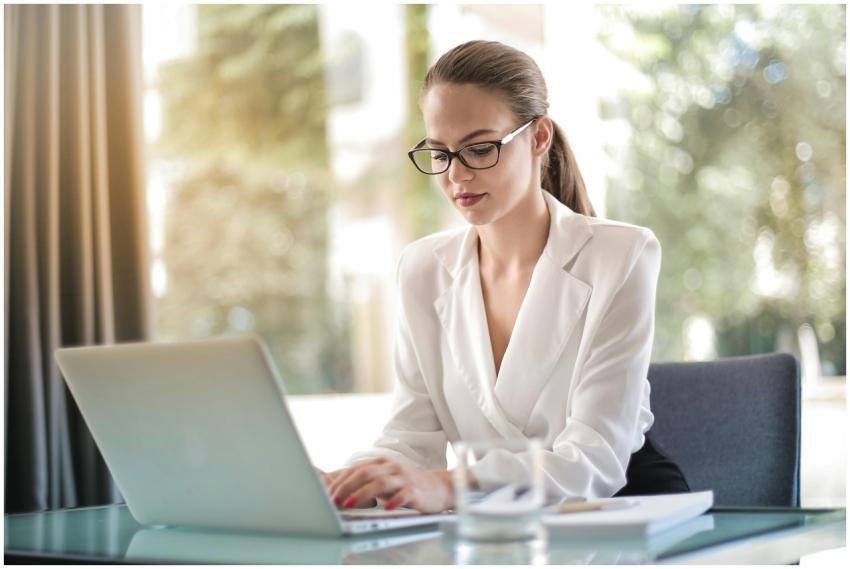 Confident businesswoman using a laptop at her desk