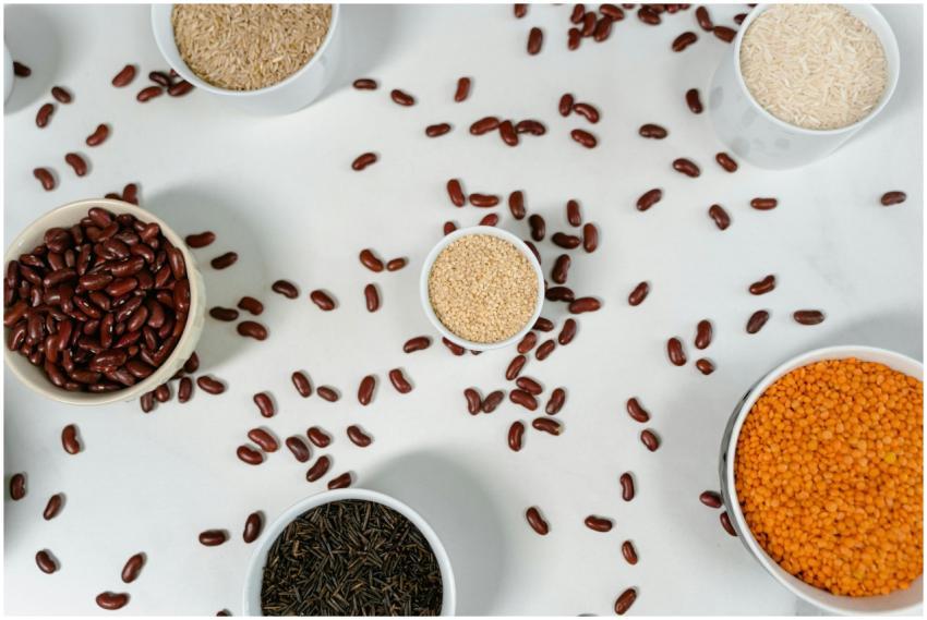 Top view of various grains and pulses in bowls on