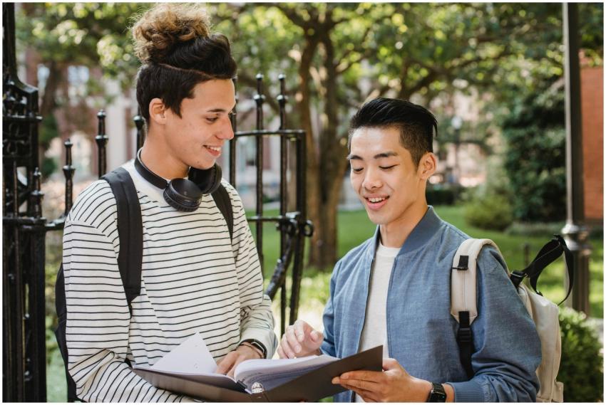 Two young college students engage in a cheerful di