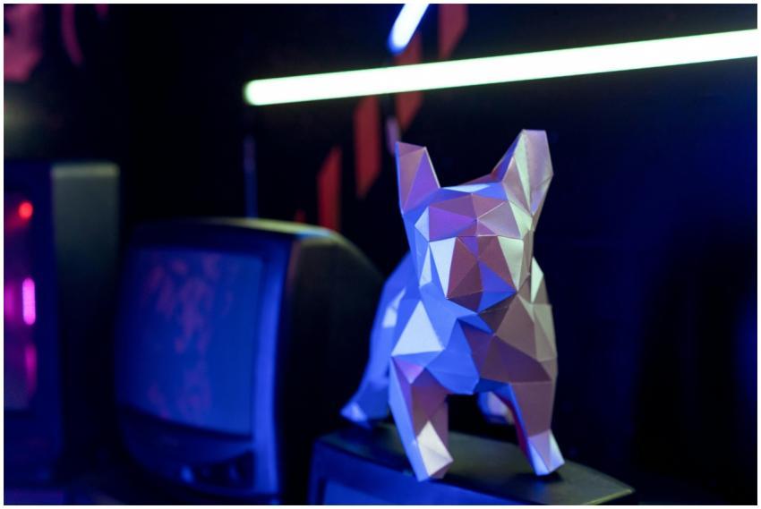 A polygonal dog sculpture in a neon-lit cyberpunk