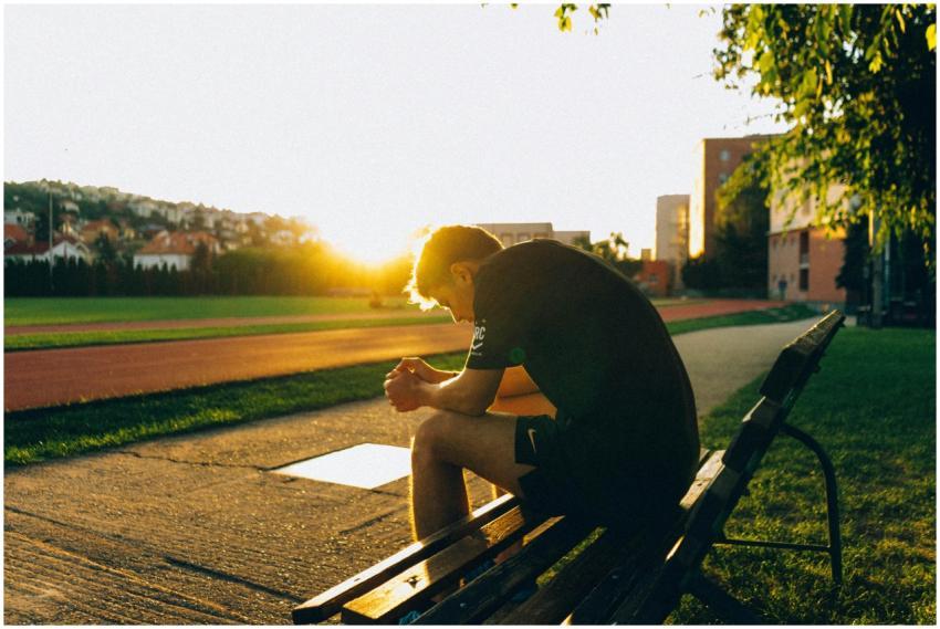 A man enjoying a quiet moment during sunset at a p