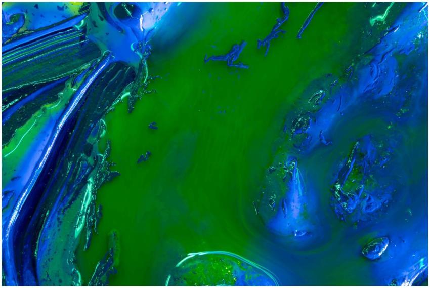 Dynamic blend of vibrant blue and green in an abst