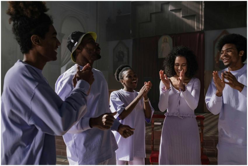 A diverse group of men and women singing joyfully