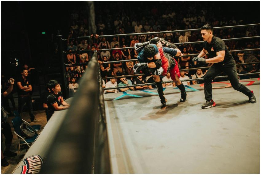 Two athletes in dynamic combat during a mixed mart