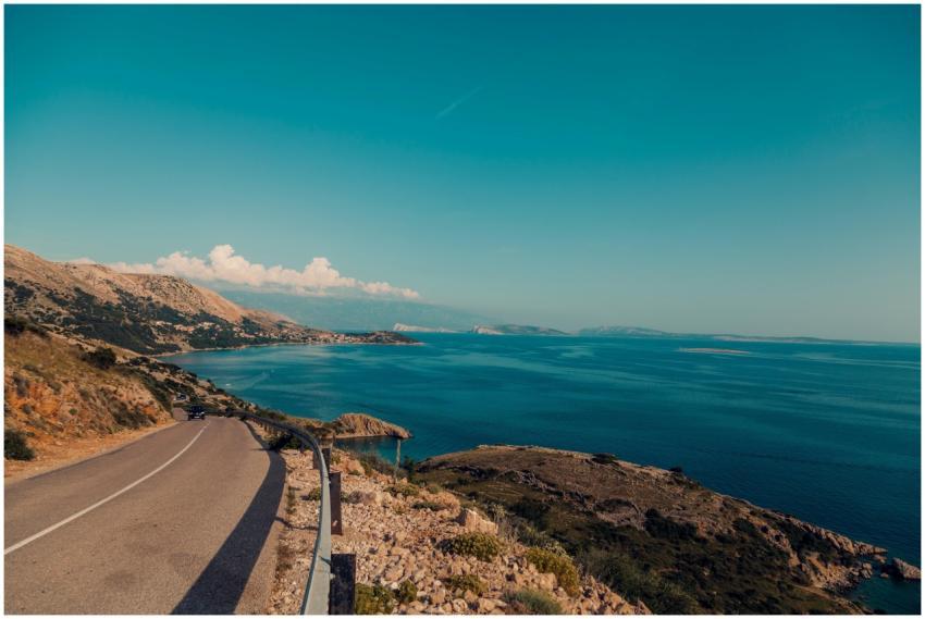 Breathtaking view of a coastal road alongside the