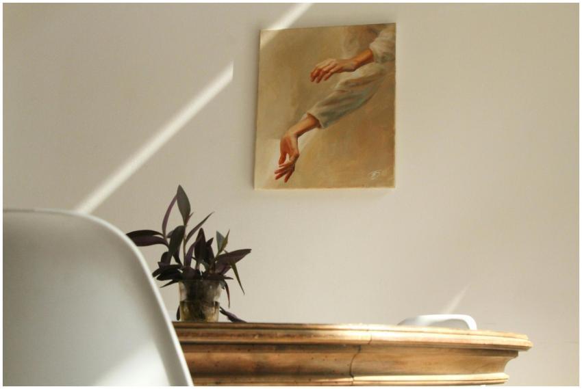 A serene minimalist room featuring a painting, woo