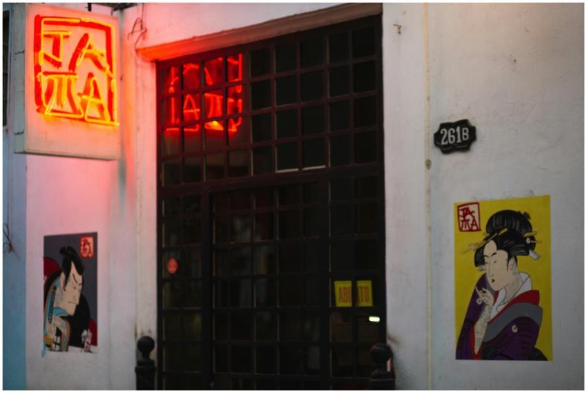 Street art depicting Japanese characters illuminat