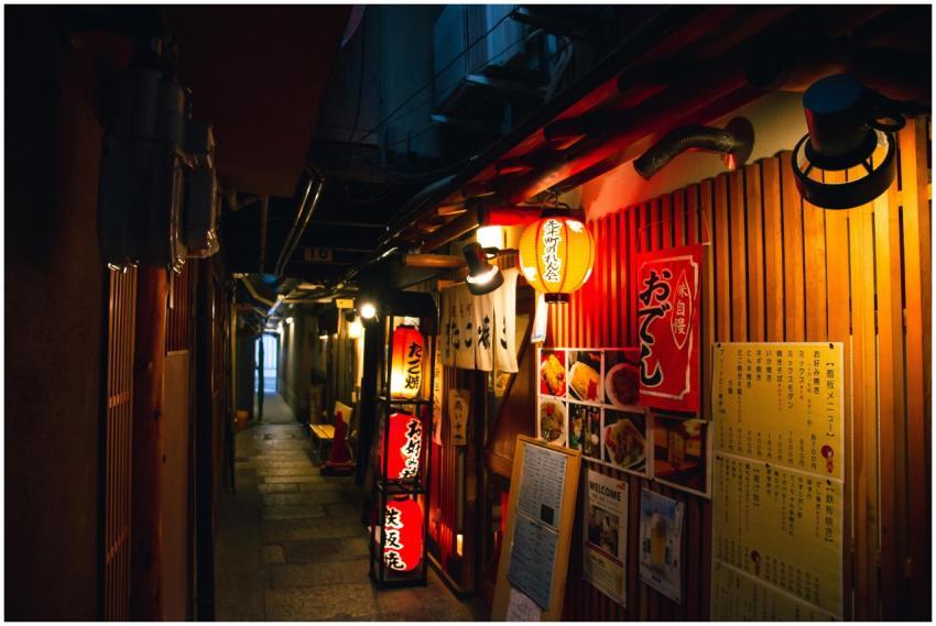 Narrow street with traditional Japanese izakaya ba